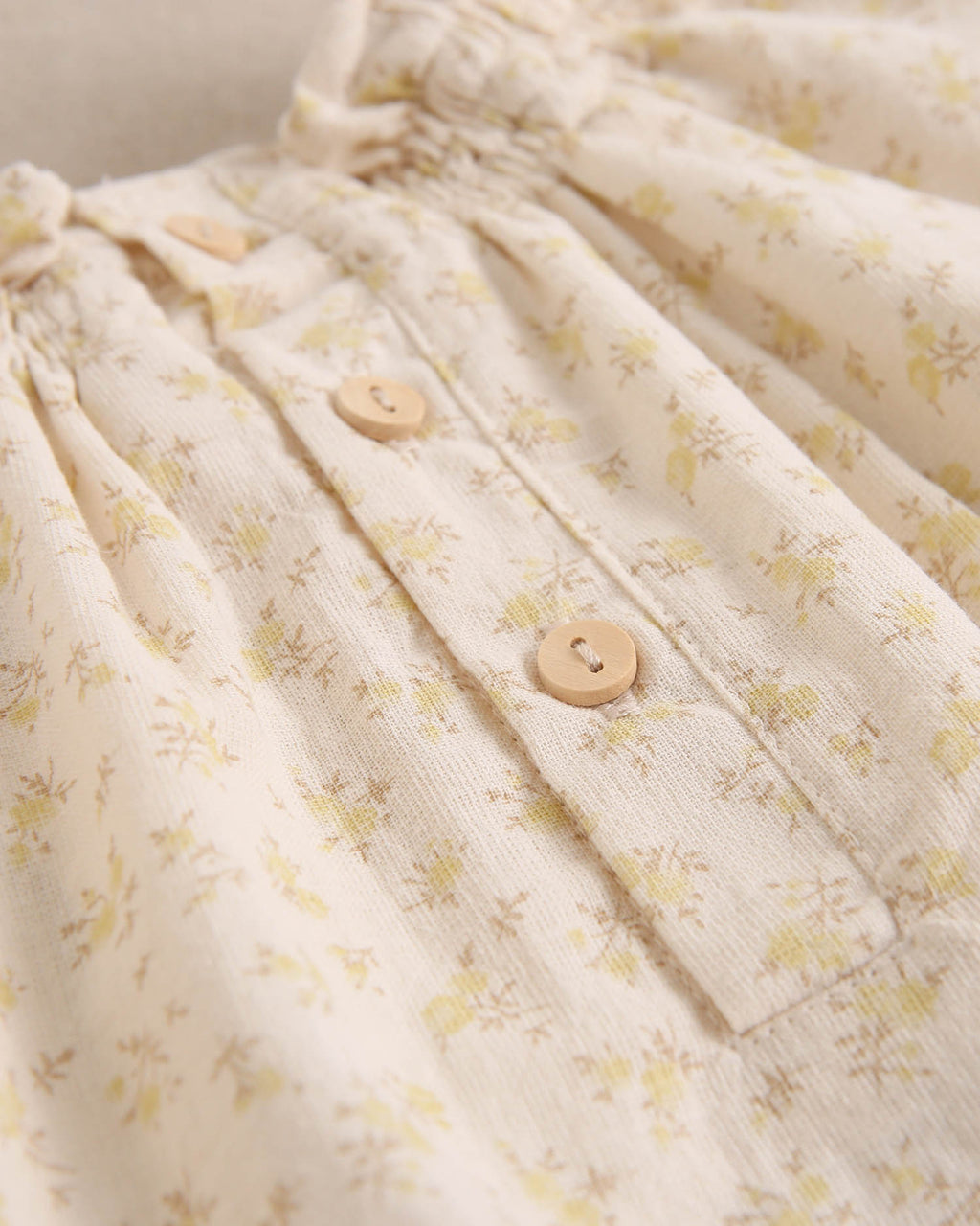 Ranita de bebé niña beige con detalle amarillo