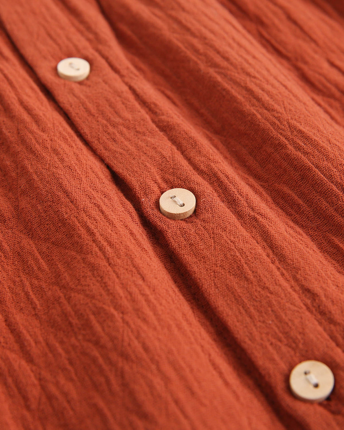 Vestido de bebé niñacolor teja y manga larga abullonada