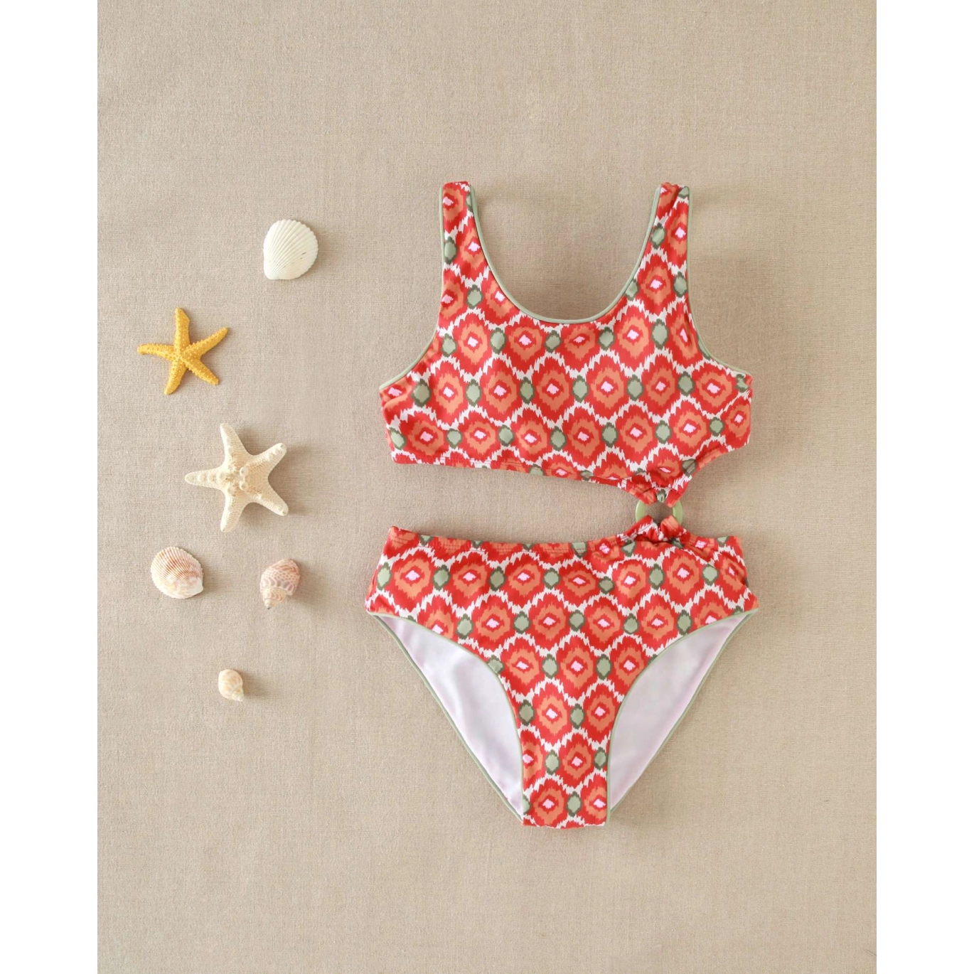 Trikini de niña con estampado geometrico y detalle en la cintura