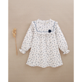 Vestido de niña de bambula blanca floral y pompón azul